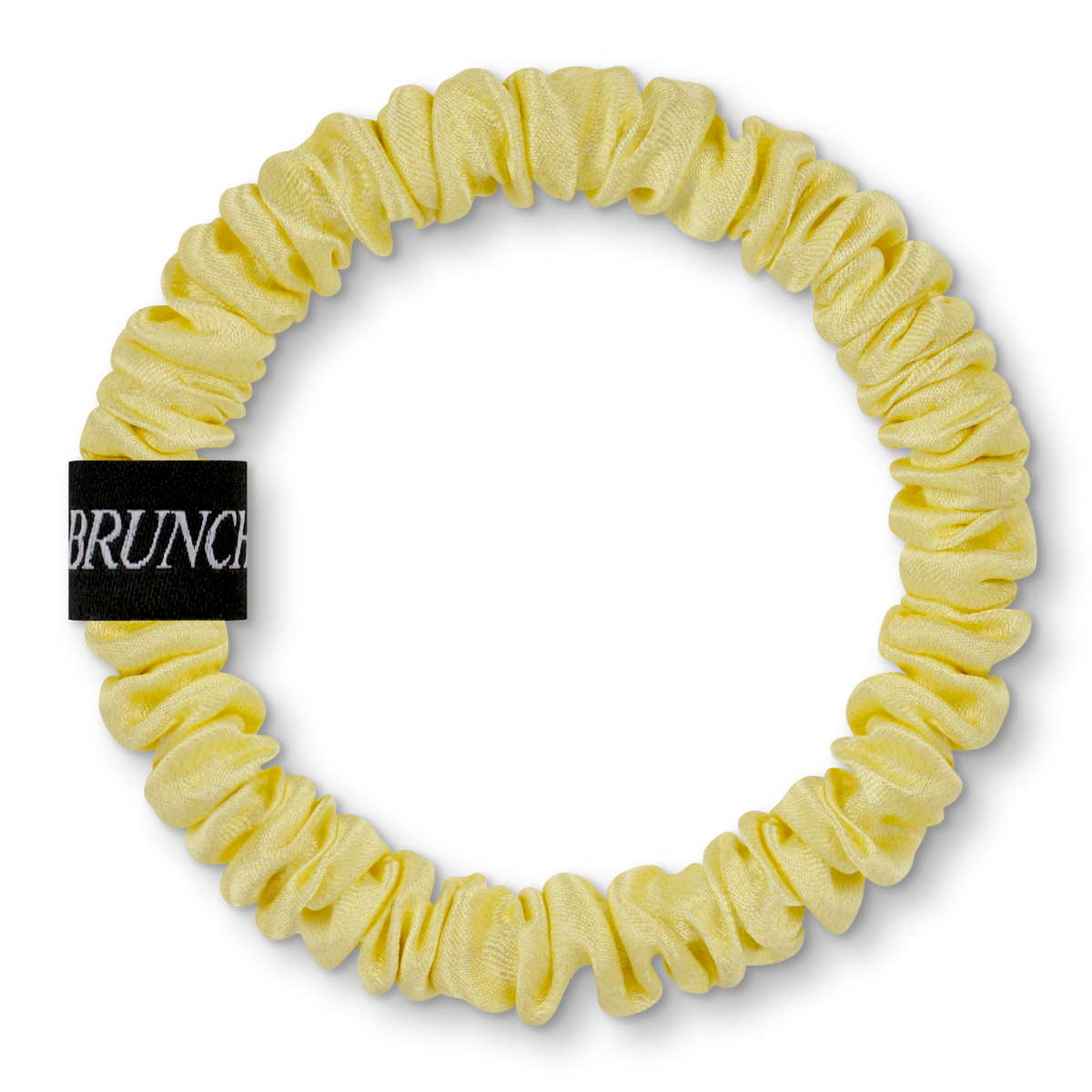 Einfarbiger BRUNCHIES® Seiden Scrunchie Buttermilk in modernem Buttergelb aus 100 % Maulbeerseide.